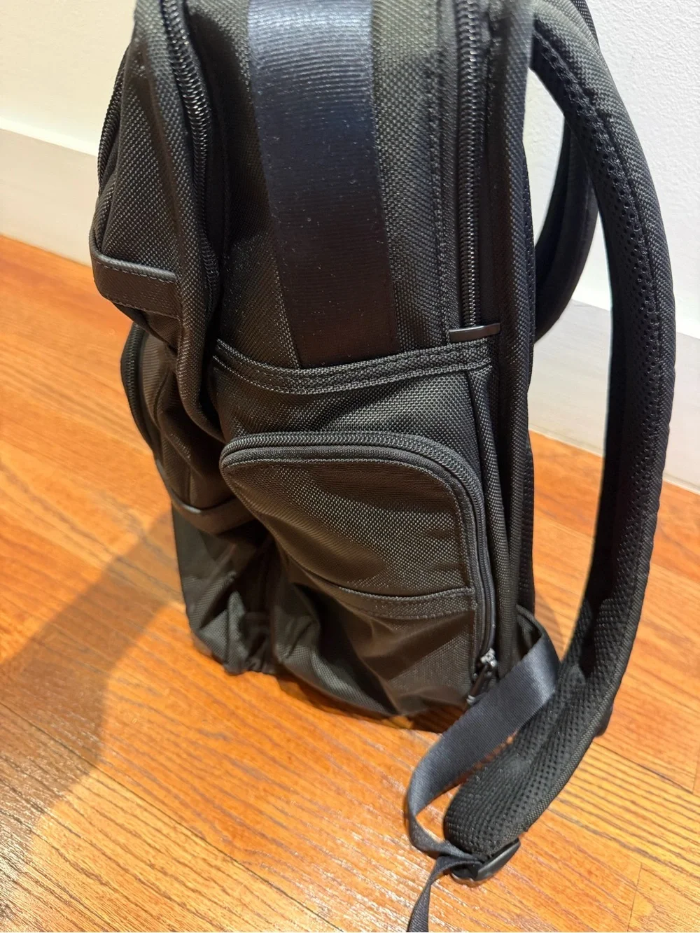 Tumi Black Backpack with Multiple Front Pockets